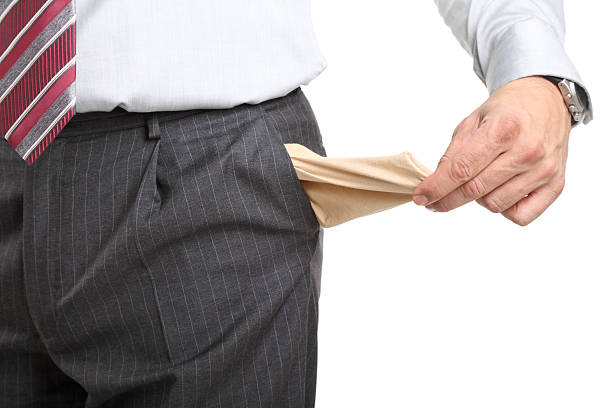 Male hand pulling pocket out of pants to show it is empty, isolated on white background